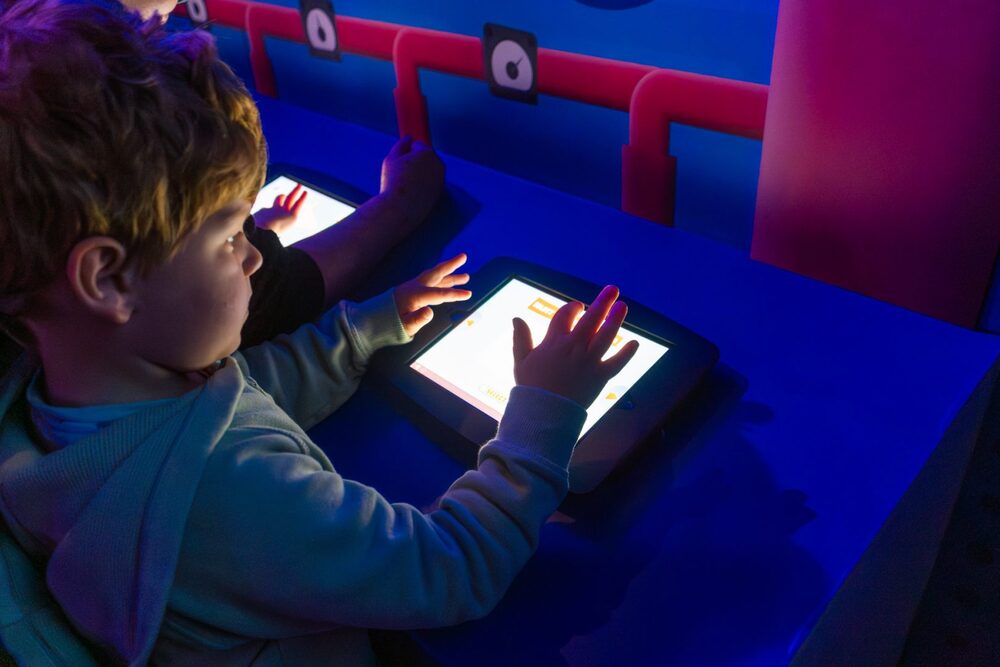 A child drawing on a tablet